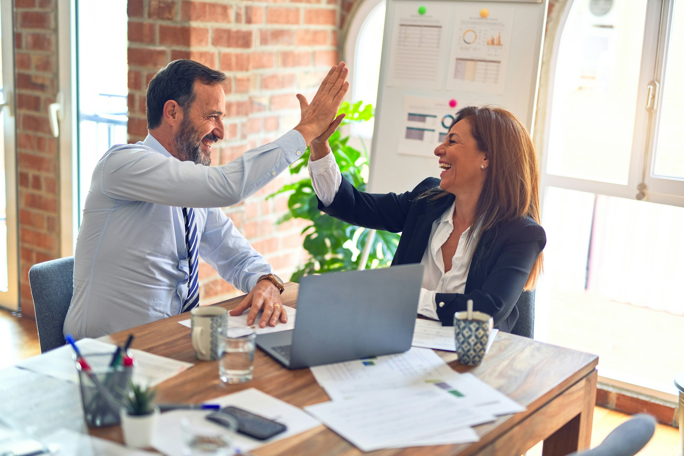 Executives reviewing an automotive M&A transaction